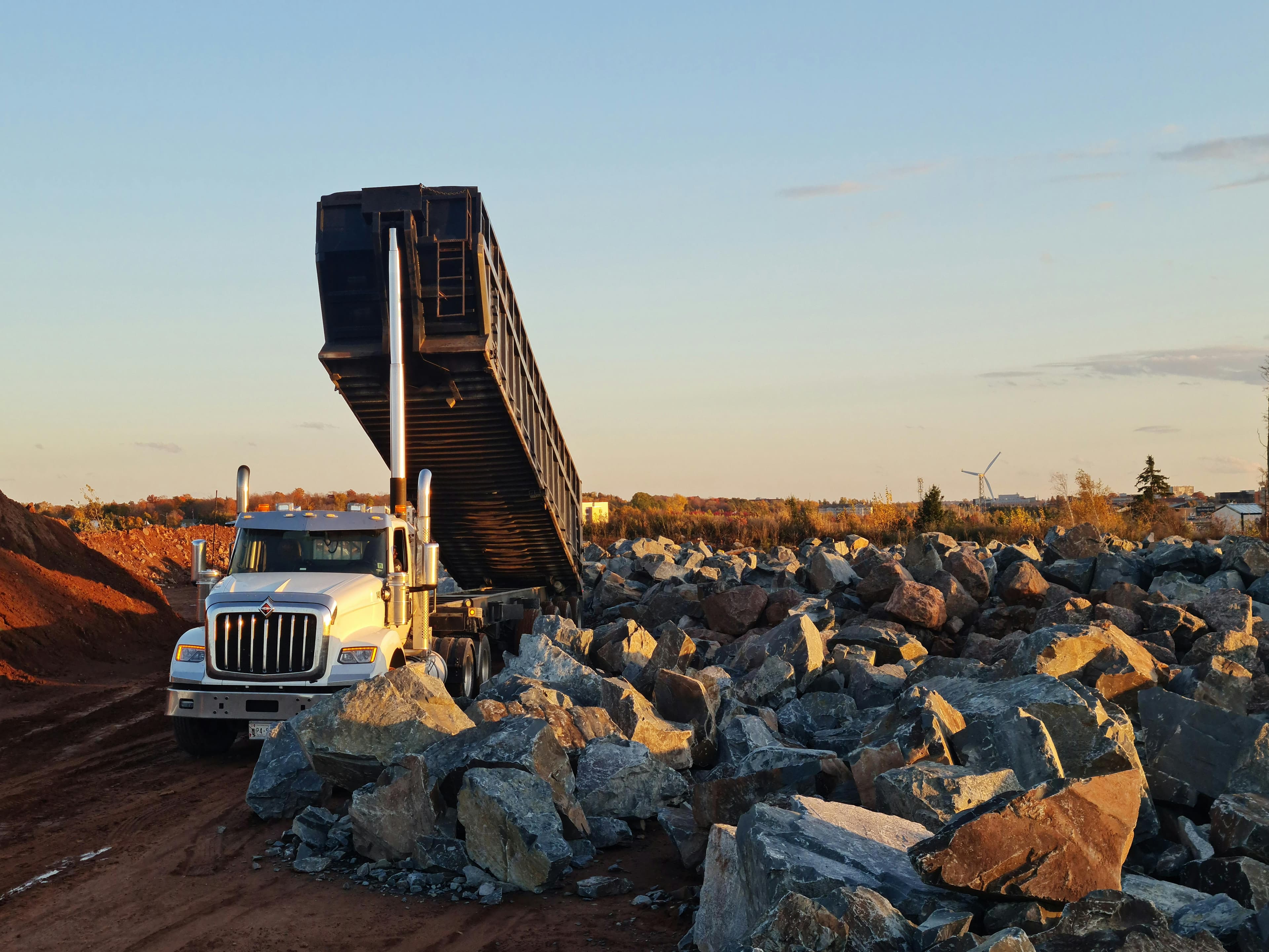 How Much Does a Quad Axle Dump Truck Load of Gravel Cost in 2026?